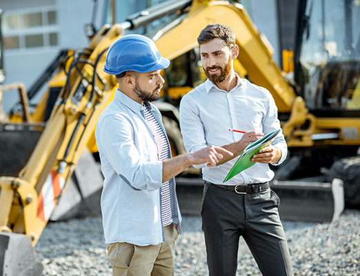 Men by heavy equipment