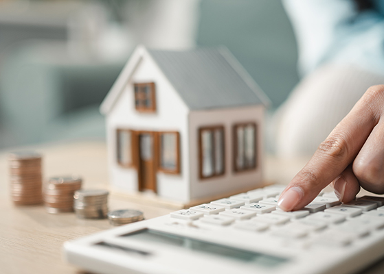 doll house, stacked coins, calculator